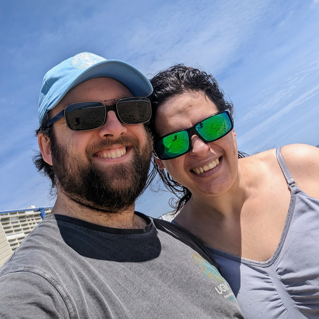 Eli and Sarah smiling at the beach